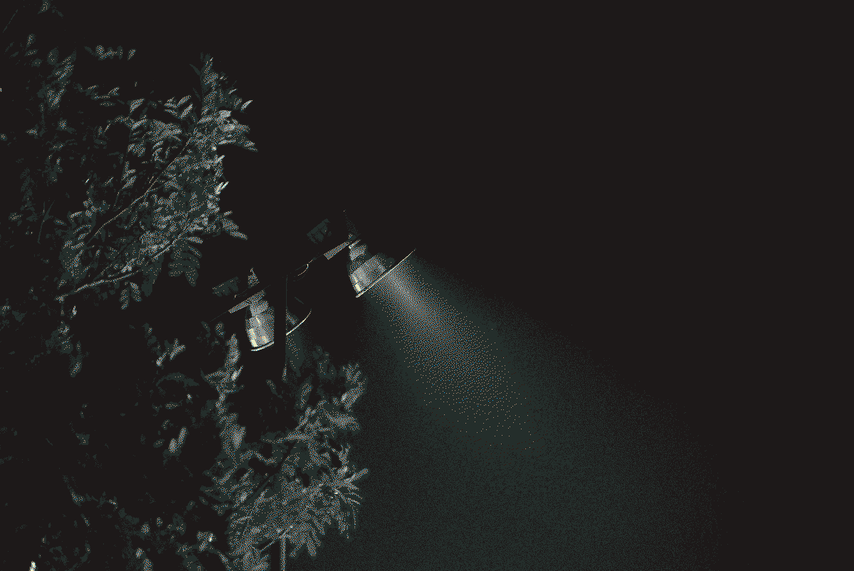 a dithered photo of a street lamp, in black and white